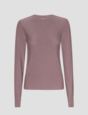 mauve long-sleeve fitted crew neck shirt on a light gray background. 