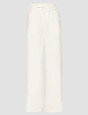 white mid-rise wide leg sweatpants with side slits and a drawcord at waistband. 