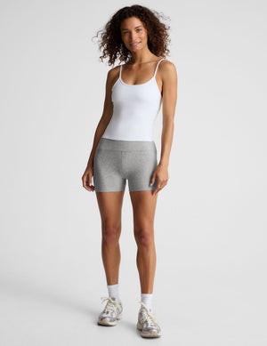 white midway length tank with adjustable spaghetti straps. 