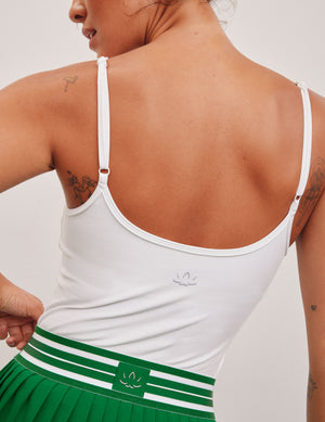 white midway length tank with adjustable spaghetti straps. 